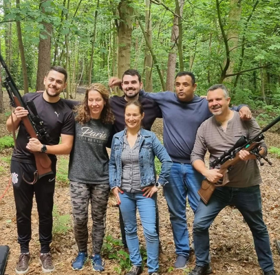 Off-road activity group standing together on a woodland track